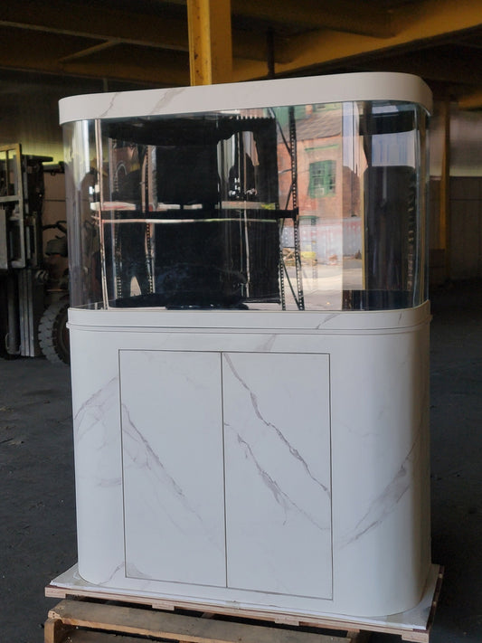 White marble-patterned display case with glass front on a wooden pallet.