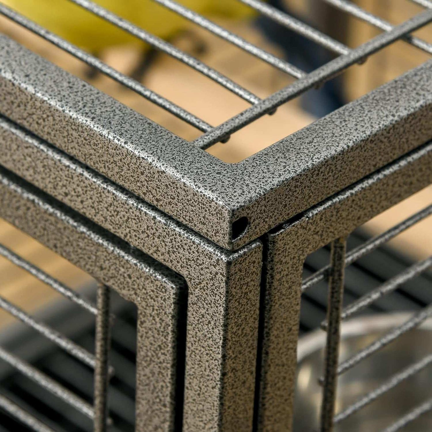 Close-up of a metal grid structure with a blurred background