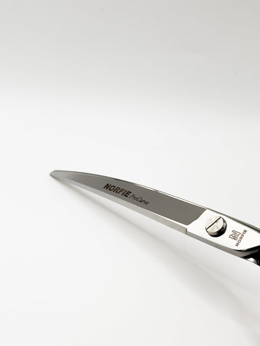 Hair cutting scissors with 'Norfie' branding on a white background