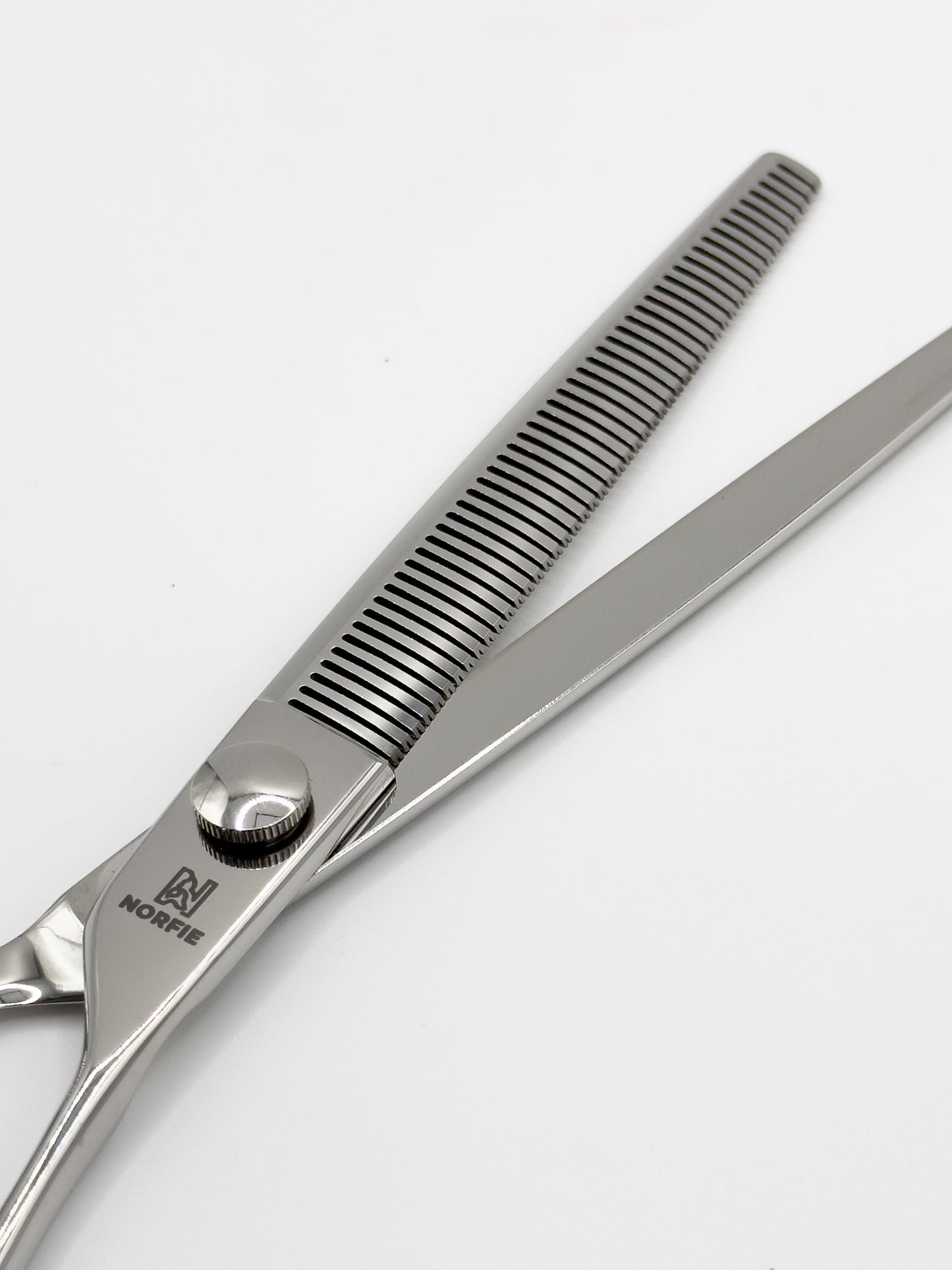 Hair cutting scissors with a visible brand logo on a white background
