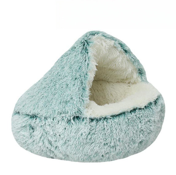 Teal and white fluffy pet bed on a white background
