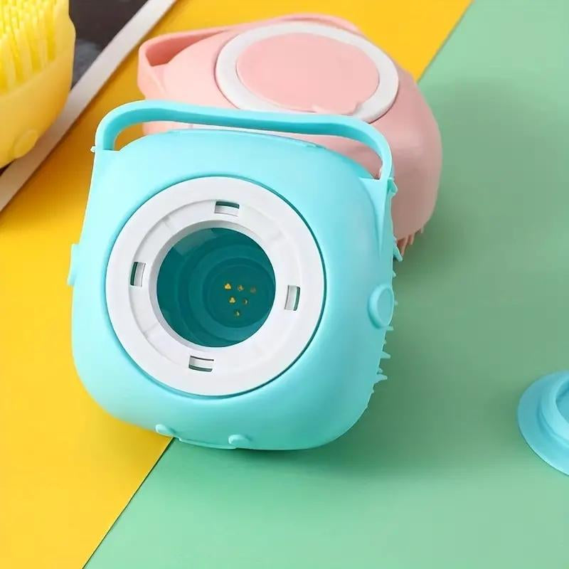 Teal and pink toy camera on a colorful background.