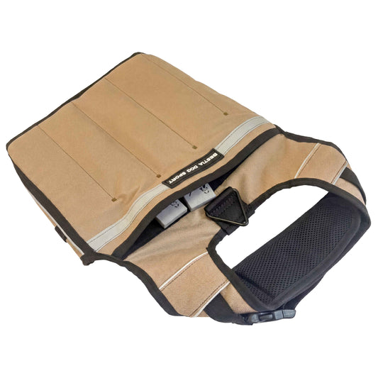 Dog harness with padding and adjustable straps on a white background