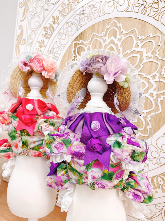 Decorative dolls with floral hats and colorful outfits on a decorative background