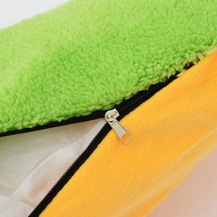 Close-up of a green and yellow fabric with a zipper