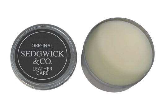 Sedgwick & Co. leather care product in a round tin on a white background