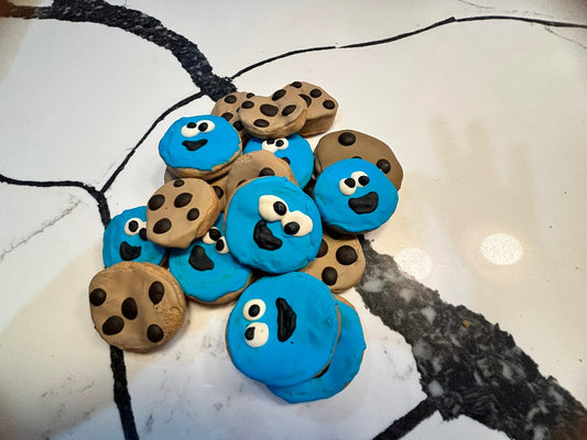 Cookie monster-themed cookies on a white surface with black cracks