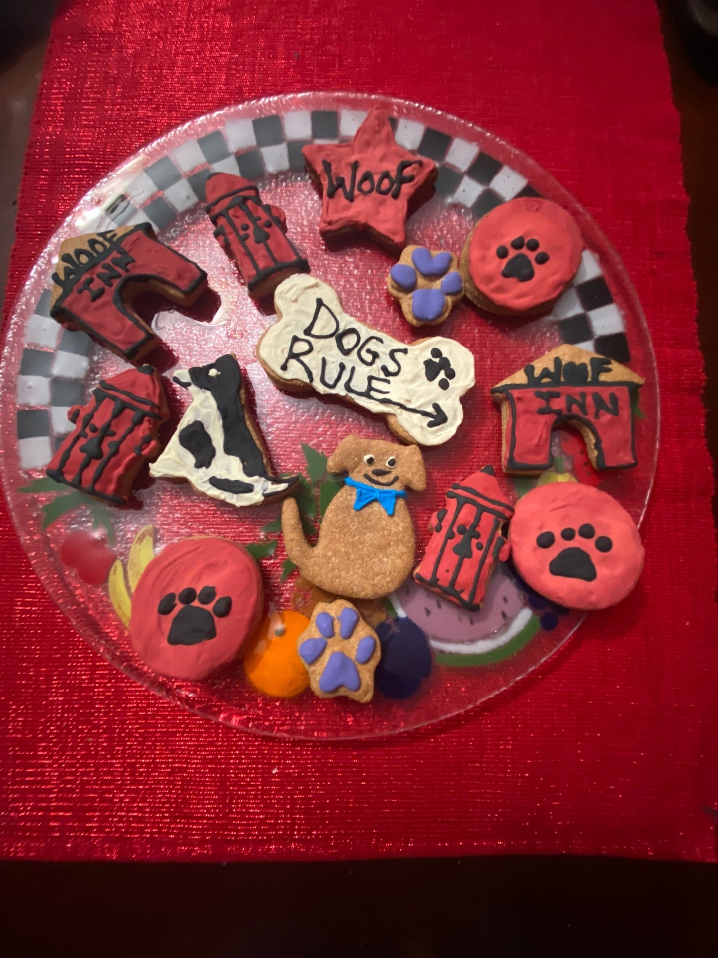 Collection of dog-themed cookies on a red background