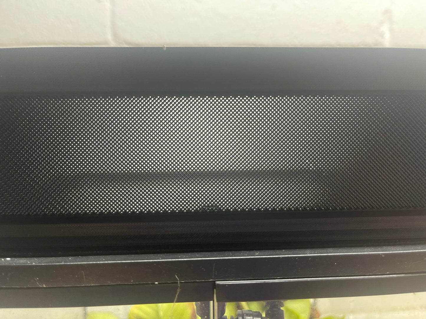 Black textured object on a white background