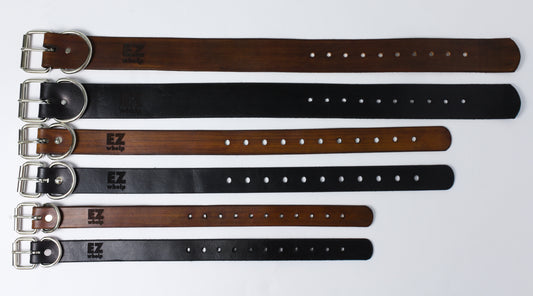 Set of leather belts in various colors on a white background