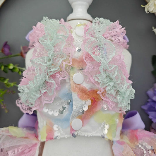 Pastel-colored floral dress on a mannequin with sequins and lace details.