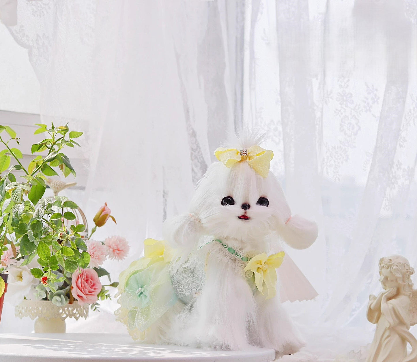 White dog plush toy with a yellow bow on a white background