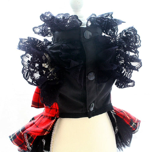Black jacket with floral details and red plaid skirt on a mannequin against a white background