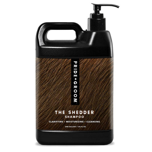 Large black and wood-textured bottle of 'The Shredder Shampoo' by Pride & Groom on a white background