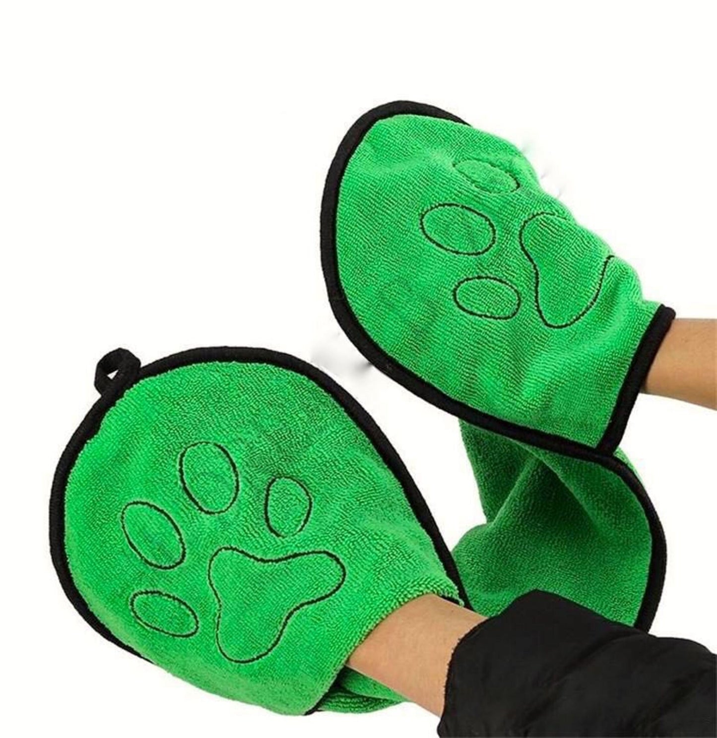 Green mittens with paw prints on a white background