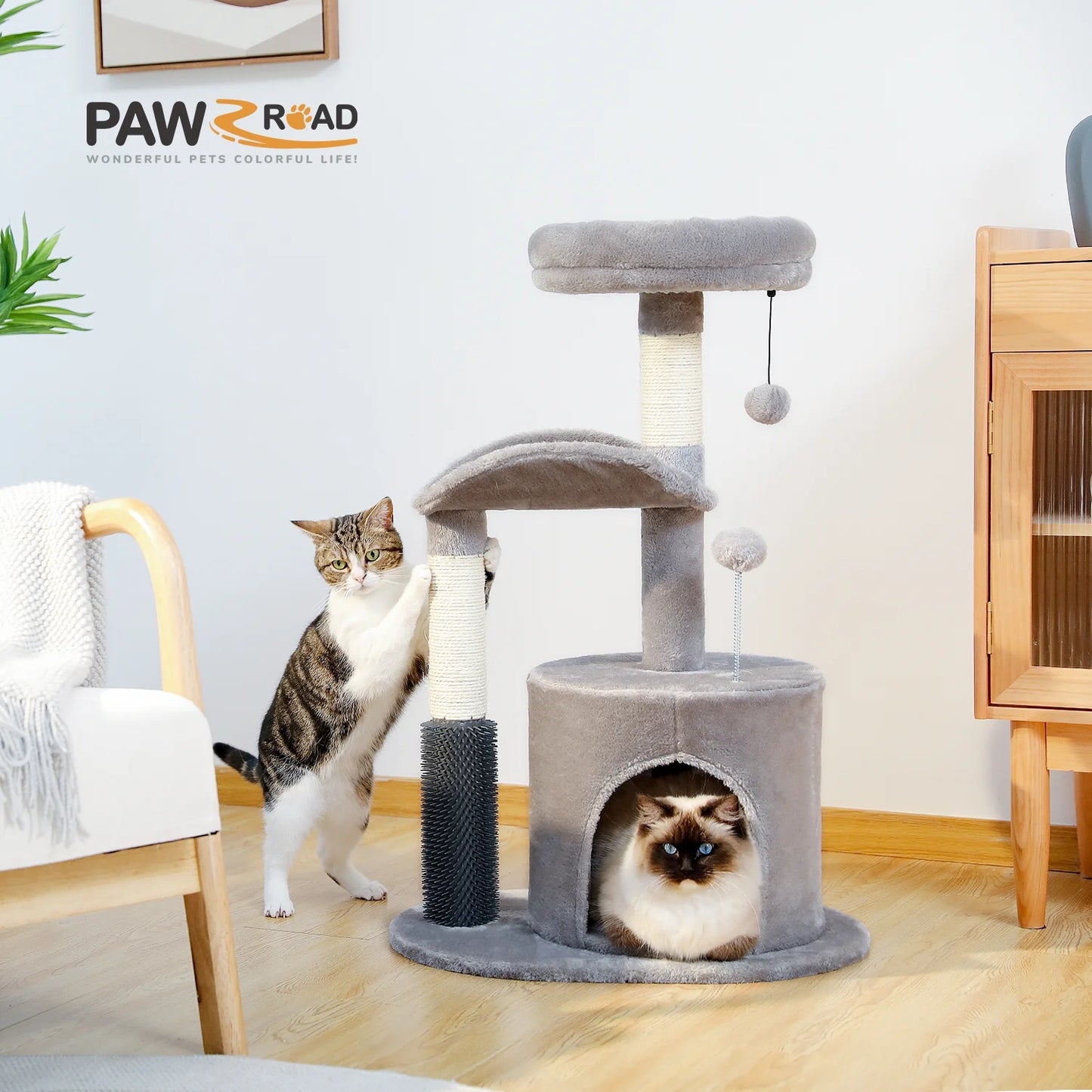 Cat Tree with two Cats inside of a room with furniture and decor.