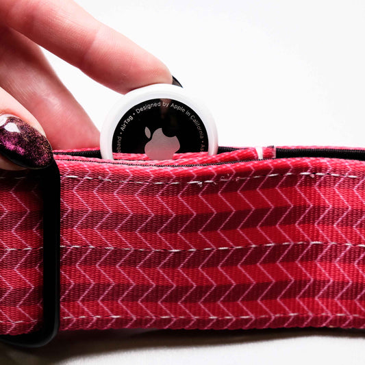 Red zigzag patterned product with a white circular object on top, held by a hand.