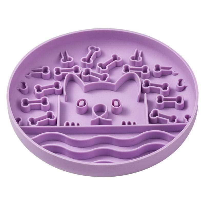 Purple silicone mold with bone-shaped cavities on a white background