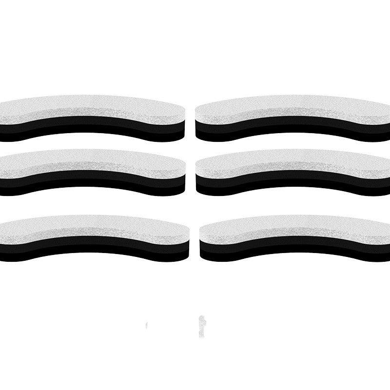 Set of six black and white wavy rubber bands on a white background