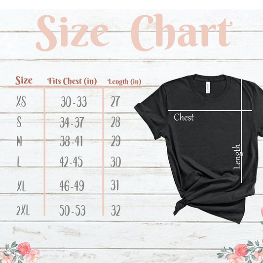 Black t-shirt with size chart on a wooden background