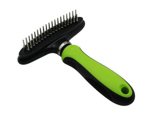 Pet grooming brush with green handle and black bristle side on a white background
