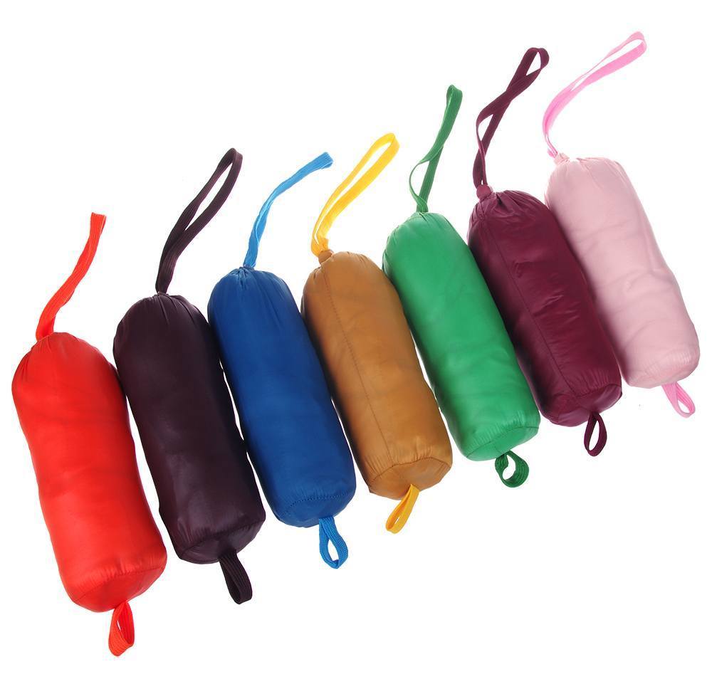 Set of colorful cylindrical dog toys with handles on a white background