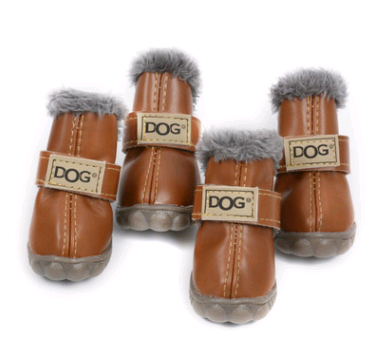 Set of brown dog boots with fur trim and 'DOG' label on a white background