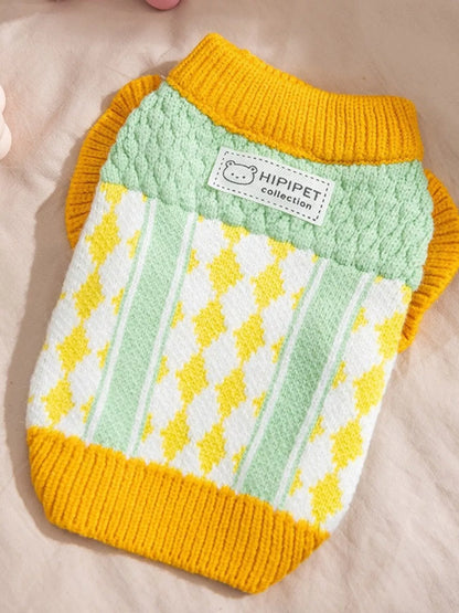 Dog sweater with yellow and green pattern on a beige background