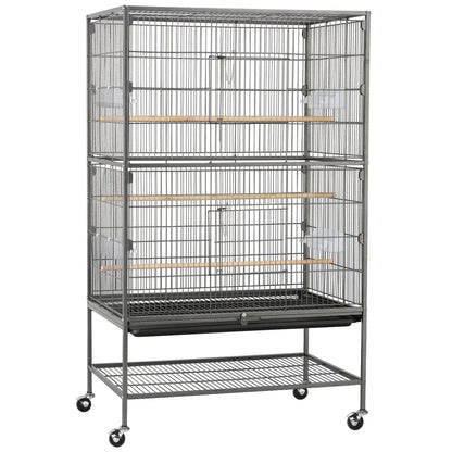 Large bird cage with multiple levels and wheels on a white background