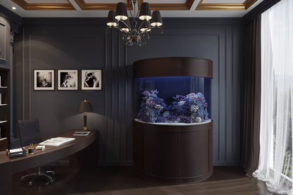 Modern office with a round aquarium, desk, and decorative elements.