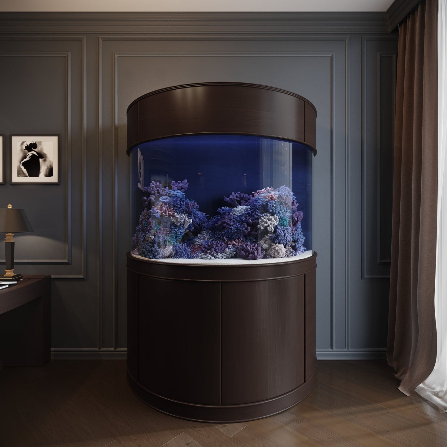 Round aquarium with underwater scenery in a room with dark walls and a lamp.