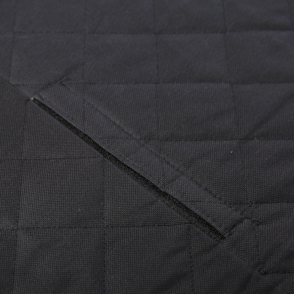 Close-up of a black quilted jacket with visible stitching details.