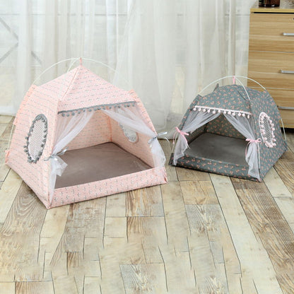 Two pet tents, one pink and one gray, on a wooden floor.