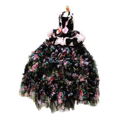 Black floral dress on a mannequin against a white background