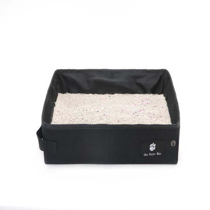 Black pet litter box with white litter on a white background