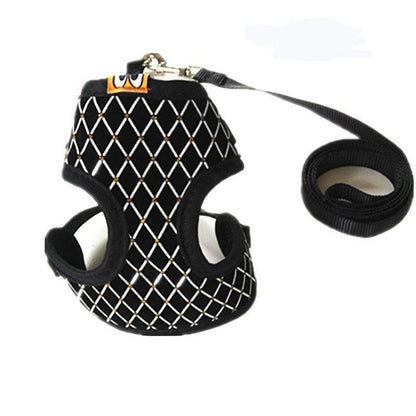 Black and white mesh pet harness with a leash on a white background