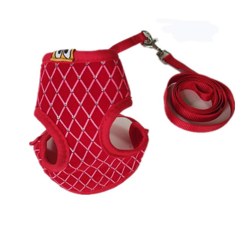 Red dog harness with chain design and matching leash on a white background