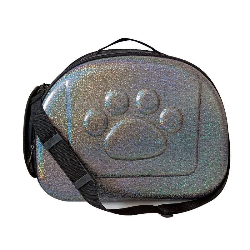 Pet carrier with a glittery finish and paw print design on a white background
