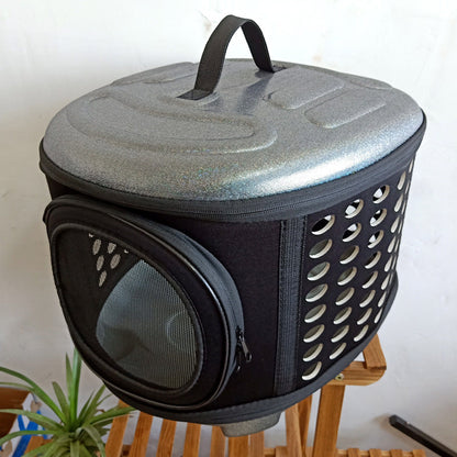 Pet carrier with a textured top and perforated sides on a white background