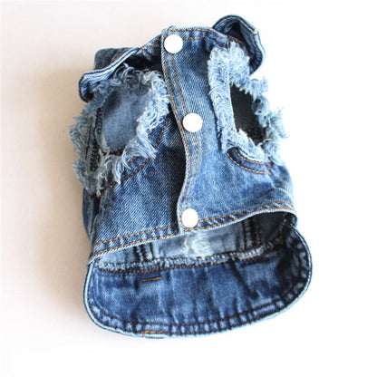 Denim dog vest with frayed edges on a white background