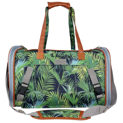 Duffle bag with tropical leaf pattern on a white background