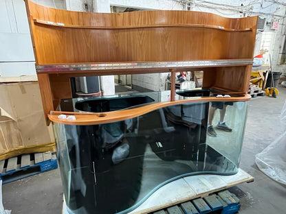 Wooden and glass aquarium on a pallet in an indoor setting