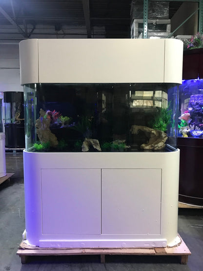 Large fish tank with a white cabinet in an indoor setting