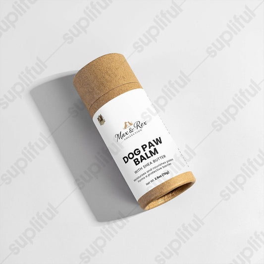 Dog paw balm in a cylindrical container with a cork lid on a light gray background