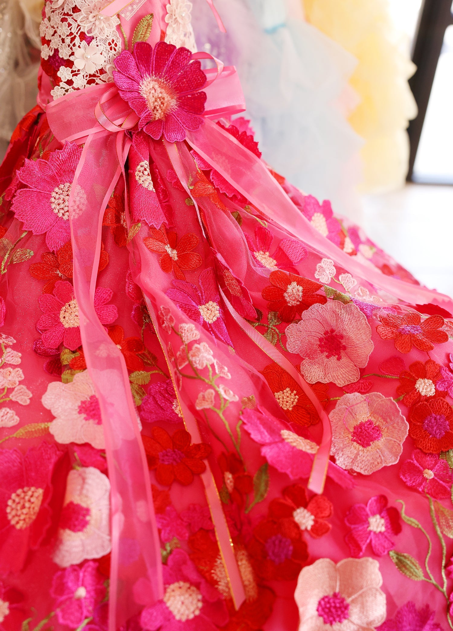 Red floral dress with pink flowers and ribbons
