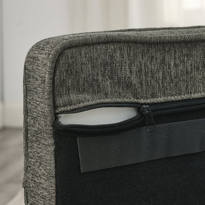 Close-up of a gray textured bag with a zipper, blurred background