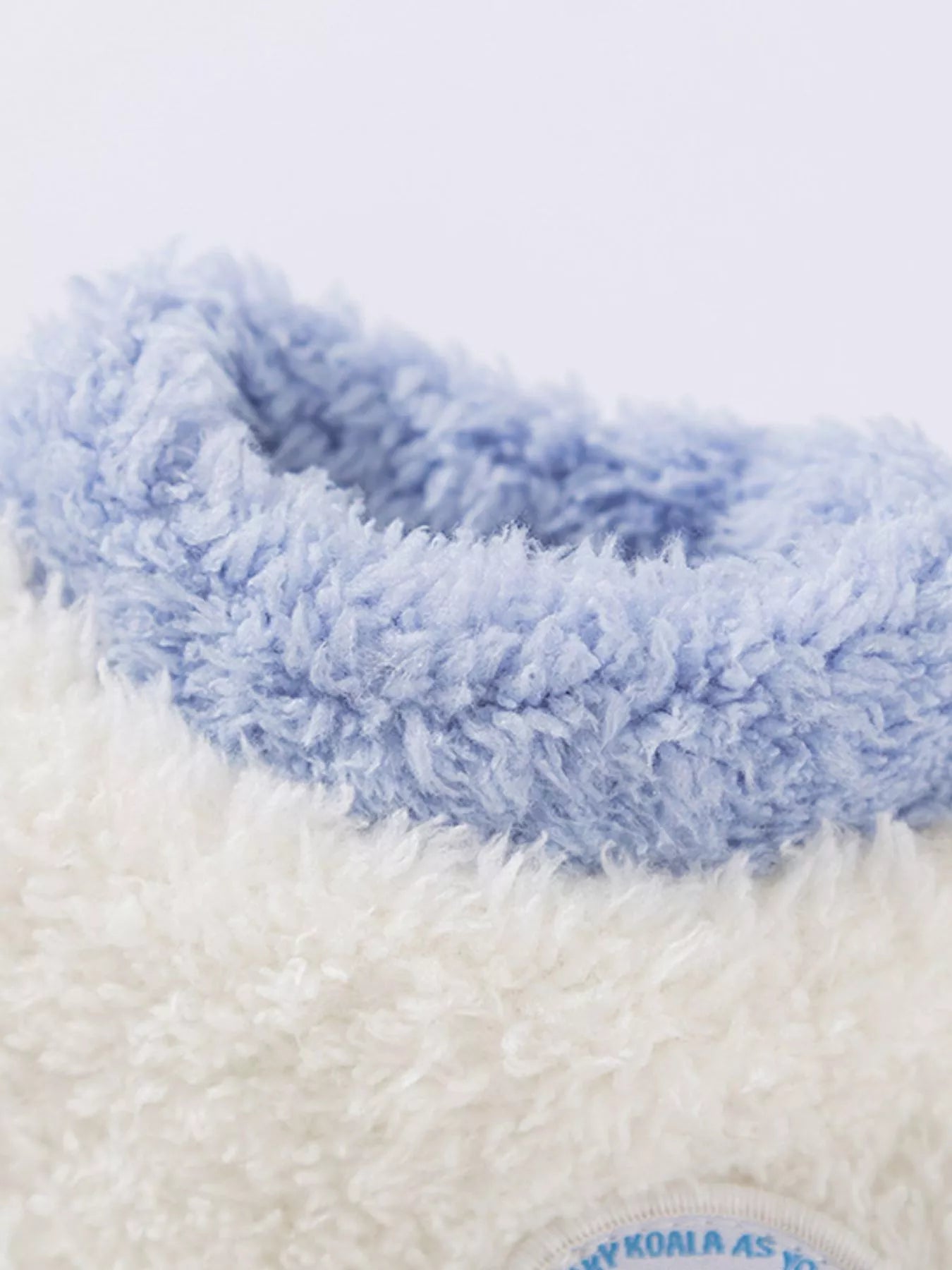 Close-up of a blue and white textured product with 'Koala' branding.