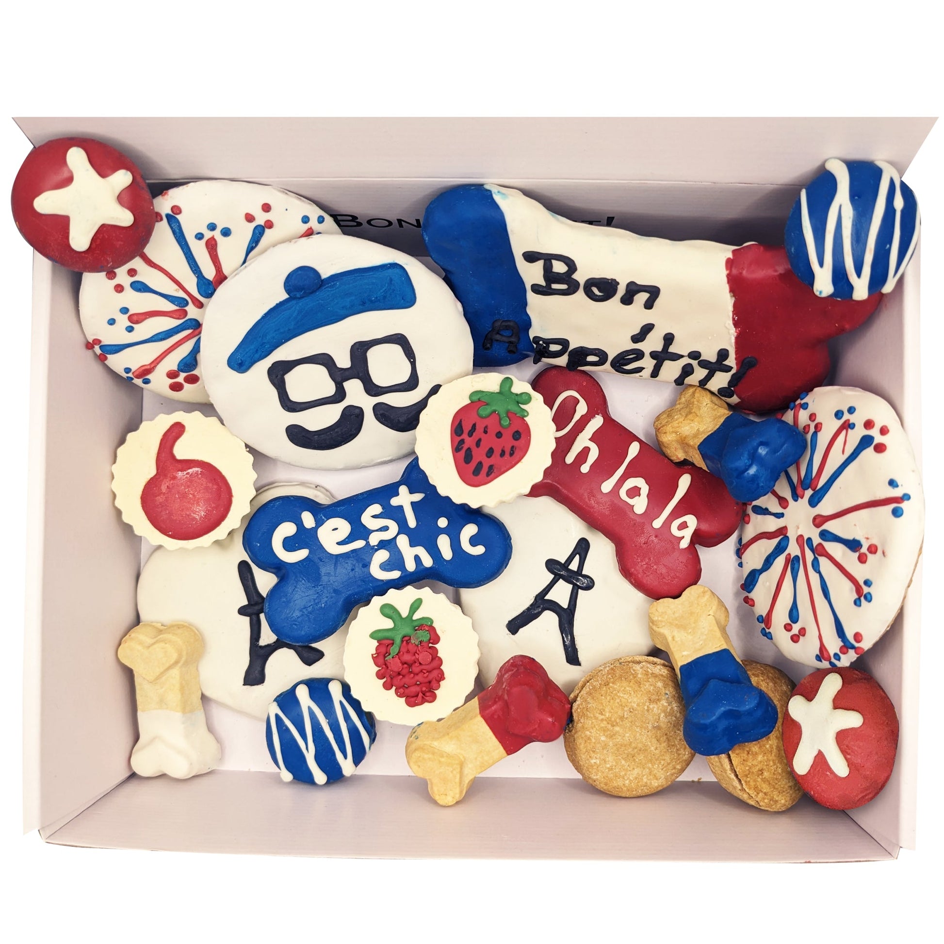 Assorted cookies with colorful designs and text in a box