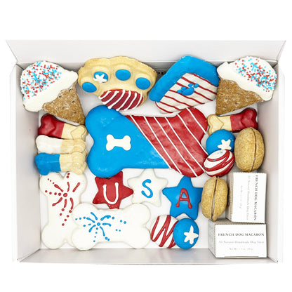 Assorted dog treats in a box with patriotic designs