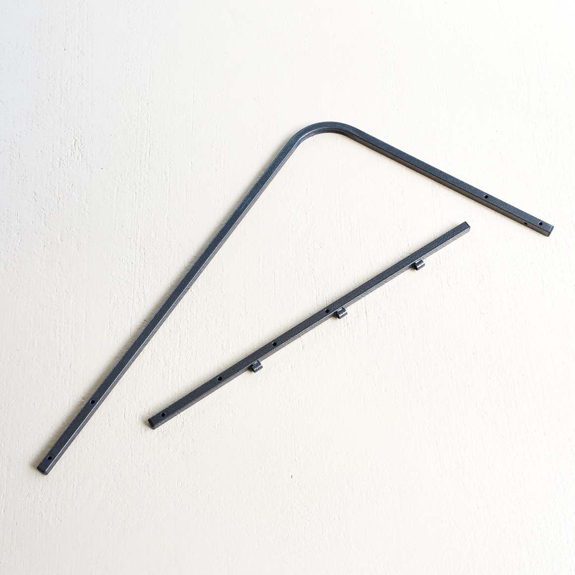 Two metal brackets on a white background